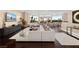 Spacious living room features modern furnishings and a view of the backyard through expansive windows at 5020 Spanish Heights Dr, Las Vegas, NV 89148