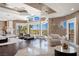 The main bedroom has large windows, a fireplace, and hardwood floors providing ample light at 5020 Spanish Heights Dr, Las Vegas, NV 89148