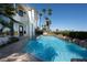 Backyard pool features rock waterfall and tropical landscaping at 5020 Spanish Heights Dr, Las Vegas, NV 89148
