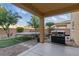 Landscaped backyard featuring a grill and trampoline at 5144 Poem Ct, North Las Vegas, NV 89081