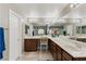 Large bathroom with double sinks, vanity, long countertop, and well-lit mirrors at 5144 Poem Ct, North Las Vegas, NV 89081