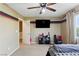 Comfortable bedroom featuring a ceiling fan and view from a large window at 5144 Poem Ct, North Las Vegas, NV 89081