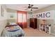 Cozy bedroom features a patterned wall and ample natural light at 5144 Poem Ct, North Las Vegas, NV 89081