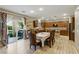 This home has a dining area with wood-look tile flooring and seamless flow to the outdoor space at 5144 Poem Ct, North Las Vegas, NV 89081