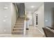 Inviting entryway with stairs, tiled floors, and a bright, welcoming atmosphere at 5144 Poem Ct, North Las Vegas, NV 89081
