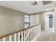 Upstairs hallway with carpet, white doors, and natural lighting at 5144 Poem Ct, North Las Vegas, NV 89081