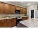 This kitchen features granite countertops, stainless steel appliances, and plenty of cabinet space at 5144 Poem Ct, North Las Vegas, NV 89081