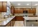 This kitchen features granite countertops, stainless steel appliances, and ample cabinet space at 5144 Poem Ct, North Las Vegas, NV 89081
