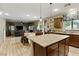 This kitchen features granite countertops, stainless steel appliances, and seamless flow to the living area at 5144 Poem Ct, North Las Vegas, NV 89081