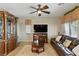 Comfortable living room with a ceiling fan and a cozy fireplace at 5144 Poem Ct, North Las Vegas, NV 89081