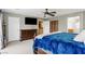 Spacious primary bedroom with a ceiling fan and ensuite bathroom at 5144 Poem Ct, North Las Vegas, NV 89081