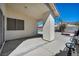 Spacious back patio with a textured pillar, perfect for outdoor gatherings at 520 Stonehurst Dr, North Las Vegas, NV 89031
