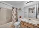 Bathroom featuring a tub and shower combo and a decorative floral curtain at 520 Stonehurst Dr, North Las Vegas, NV 89031