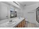 Bright bathroom featuring dual sinks, and a shower and tub combo at 520 Stonehurst Dr, North Las Vegas, NV 89031