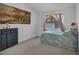 This bedroom with carpet flooring has a window with curtains at 520 Stonehurst Dr, North Las Vegas, NV 89031