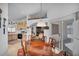 A dining room open to the kitchen, with a wood table, chairs, and access to outdoor space at 520 Stonehurst Dr, North Las Vegas, NV 89031
