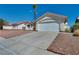 Charming single-story home features a concrete driveway and low-maintenance desert landscaping at 520 Stonehurst Dr, North Las Vegas, NV 89031