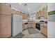 A bright kitchen with light wood cabinets and white appliances at 520 Stonehurst Dr, North Las Vegas, NV 89031