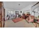 Spacious living room with bright, neutral walls and carpet flooring at 520 Stonehurst Dr, North Las Vegas, NV 89031