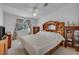 Bright bedroom with an ensuite bath and a ceiling fan at 520 Stonehurst Dr, North Las Vegas, NV 89031