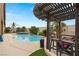 Resort-style backyard with a pool, spa, and outdoor dining area at 5940 Vizzi Ct, Las Vegas, NV 89131