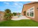 Beautifully landscaped backyard with pool, spa, and artificial grass at 5940 Vizzi Ct, Las Vegas, NV 89131