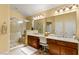 Bright bathroom with a glass-enclosed shower and dual sinks at 5940 Vizzi Ct, Las Vegas, NV 89131