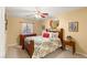 Cozy bedroom featuring a queen bed, wood furniture, and a window with natural light at 5940 Vizzi Ct, Las Vegas, NV 89131