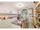 Dedicated craft room with ample storage, workspace, built-in shelving and natural light at 5940 Vizzi Ct, Las Vegas, NV 89131