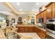 Modern kitchen with granite countertops, stainless steel appliances, and ample cabinet space at 5940 Vizzi Ct, Las Vegas, NV 89131