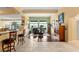 Open-concept living area featuring wood floors and seamless integration with the dining area at 5940 Vizzi Ct, Las Vegas, NV 89131