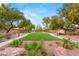 Scenic community park with well-manicured greenery, desert landscaping, and walking paths at 5940 Vizzi Ct, Las Vegas, NV 89131