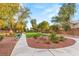 Beautiful community park featuring lush landscaping, walking paths, and comfortable seating areas under mature trees at 5940 Vizzi Ct, Las Vegas, NV 89131