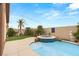 Inviting backyard featuring a pool, spa, and lush greenery at 5940 Vizzi Ct, Las Vegas, NV 89131