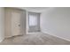 Neutral bedroom features plush carpet, a window for natural light, and a closet for ample storage at 698 S Racetrack Rd # 1521, Henderson, NV 89015
