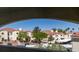 Community view showcases multiple residential buildings with red tile roofs and desert landscaping at 698 S Racetrack Rd # 1521, Henderson, NV 89015