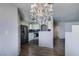 Bright, open kitchen with stainless steel appliances, white cabinets, and modern lighting at 698 S Racetrack Rd # 1521, Henderson, NV 89015
