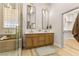 Modern bathroom with double vanity, luxurious shower with glass enclosure, and walk-in closet at 800 Jody Brook Ct, Las Vegas, NV 89145
