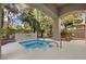 Private hot tub area under a covered patio with beautiful landscaping at 800 Jody Brook Ct, Las Vegas, NV 89145