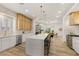 Open kitchen with quartz countertops, stainless appliances, and barstool seating at the island at 800 Jody Brook Ct, Las Vegas, NV 89145