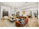 Spacious living room boasts elegant lighting, tile floors, and comfortable seating at 800 Jody Brook Ct, Las Vegas, NV 89145