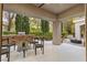 Covered outdoor kitchen and patio area with built-in grill and ample seating at 800 Jody Brook Ct, Las Vegas, NV 89145