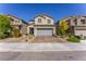 Charming two-story home featuring a neatly maintained front yard, stone pathway, and two-car garage at 9010 Eagle Wall Ct, Las Vegas, NV 89178