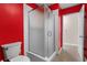 Bathroom with a glass-enclosed shower and a white toilet at 94 Fantasia Ln, Henderson, NV 89074