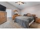 Bedroom featuring a bed, dresser, television and neutral tones at 94 Fantasia Ln, Henderson, NV 89074