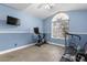 Bedroom features natural light, ceiling fan, TV and exercise equipment at 94 Fantasia Ln, Henderson, NV 89074