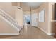 Bright entry foyer with tile floors, staircase and view of another room at 94 Fantasia Ln, Henderson, NV 89074