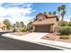 Charming two-story home featuring a well-manicured yard, tile roof, and spacious two-car garage at 94 Fantasia Ln, Henderson, NV 89074