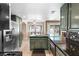 Well-equipped kitchen with stainless steel appliances and a view of the backyard pool at 94 Fantasia Ln, Henderson, NV 89074