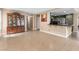 Open floor plan with kitchen bar flowing into a dining area at 94 Fantasia Ln, Henderson, NV 89074